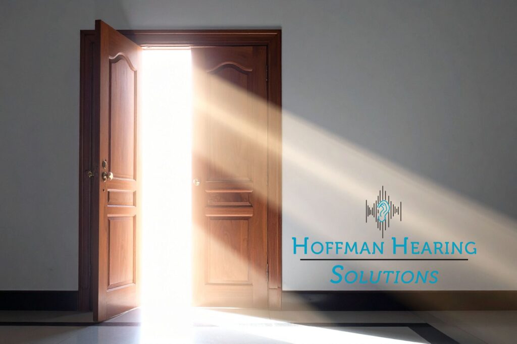 wooden door opening with light spilling out from within